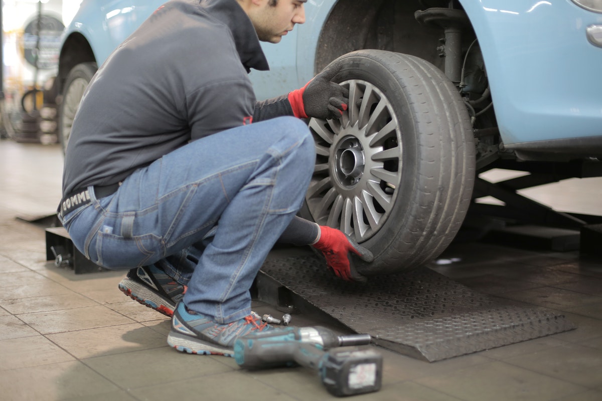 person fixing wheel